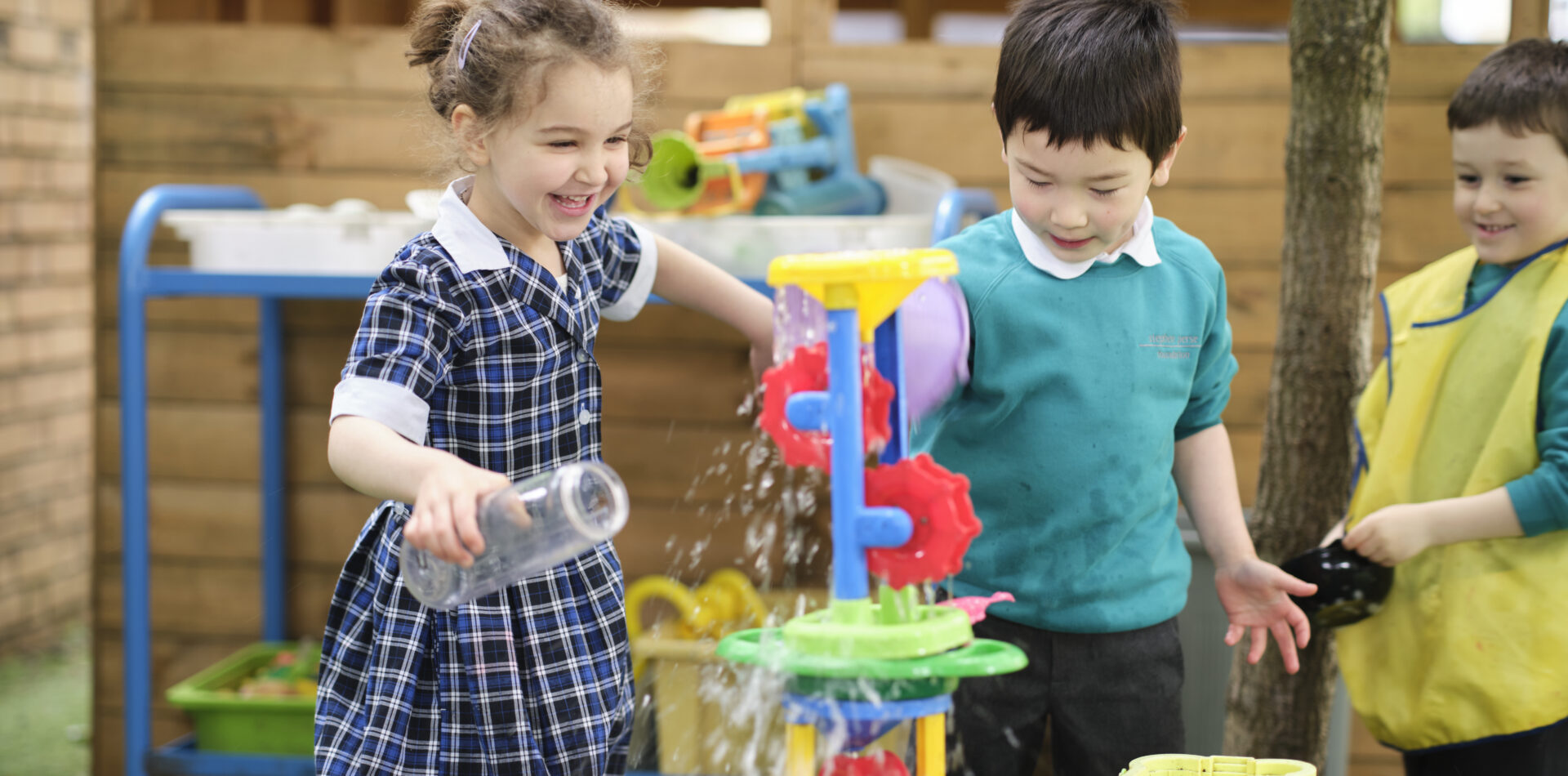 Children playing with water and containers